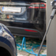 Car being charged at charging port