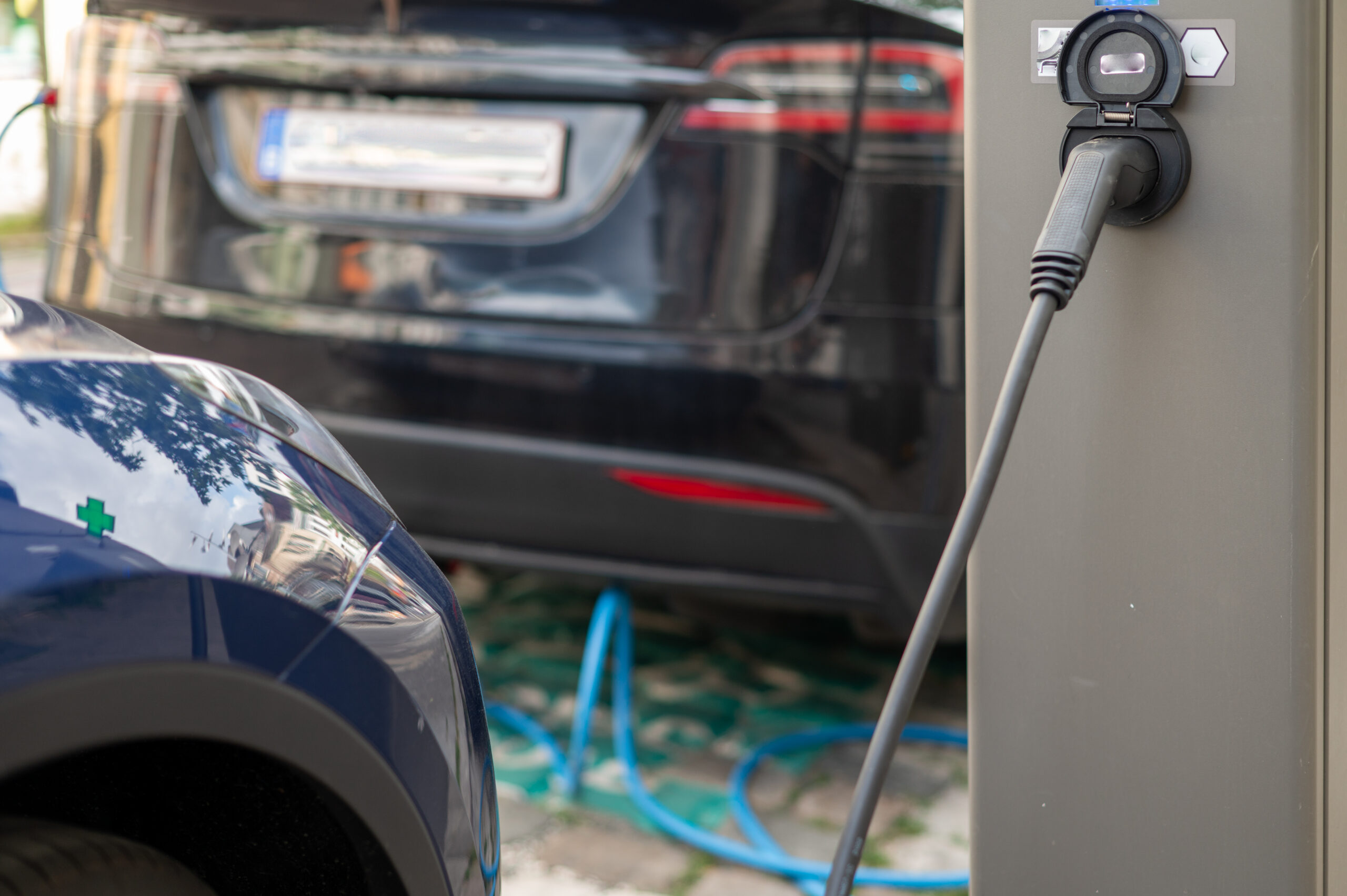 Car being charged at charging port