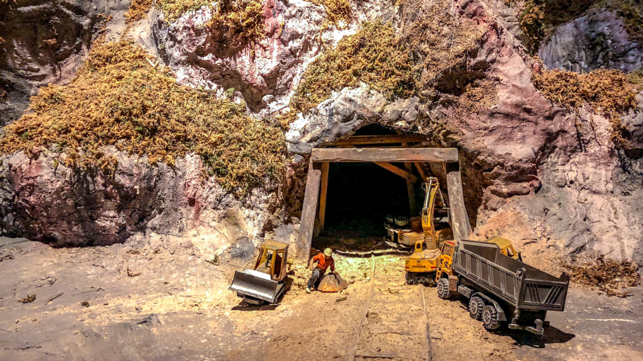 mini models miner front of the cave for mining.