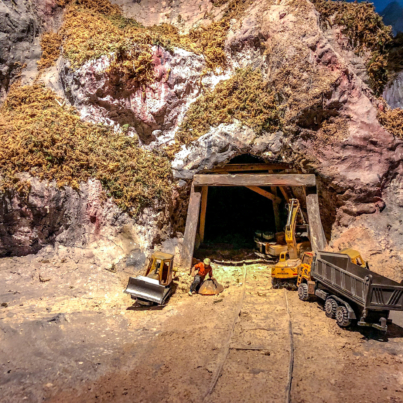 mini models miner front of the cave for mining.