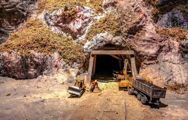 mini models miner front of the cave for mining.