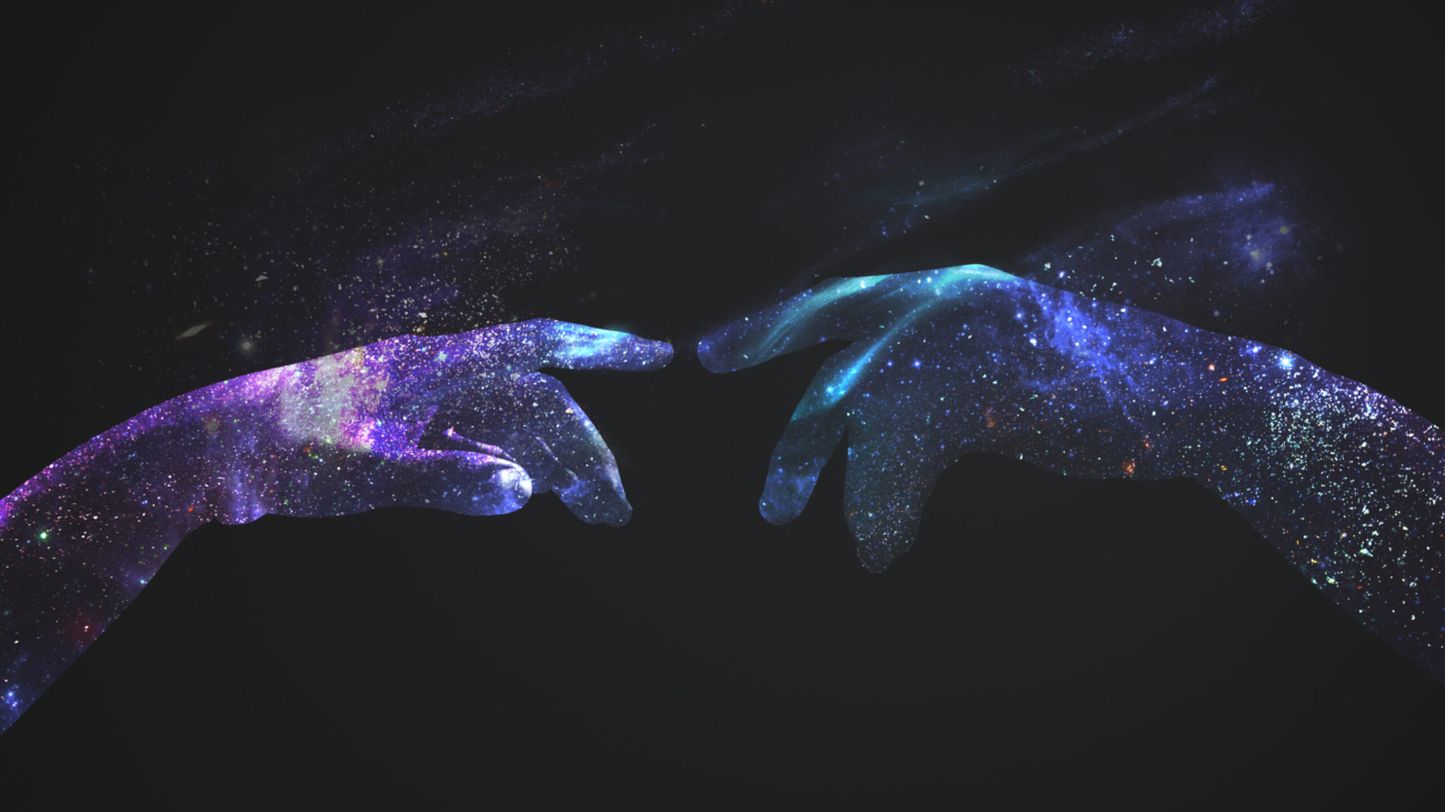 Hands in a digital universe background